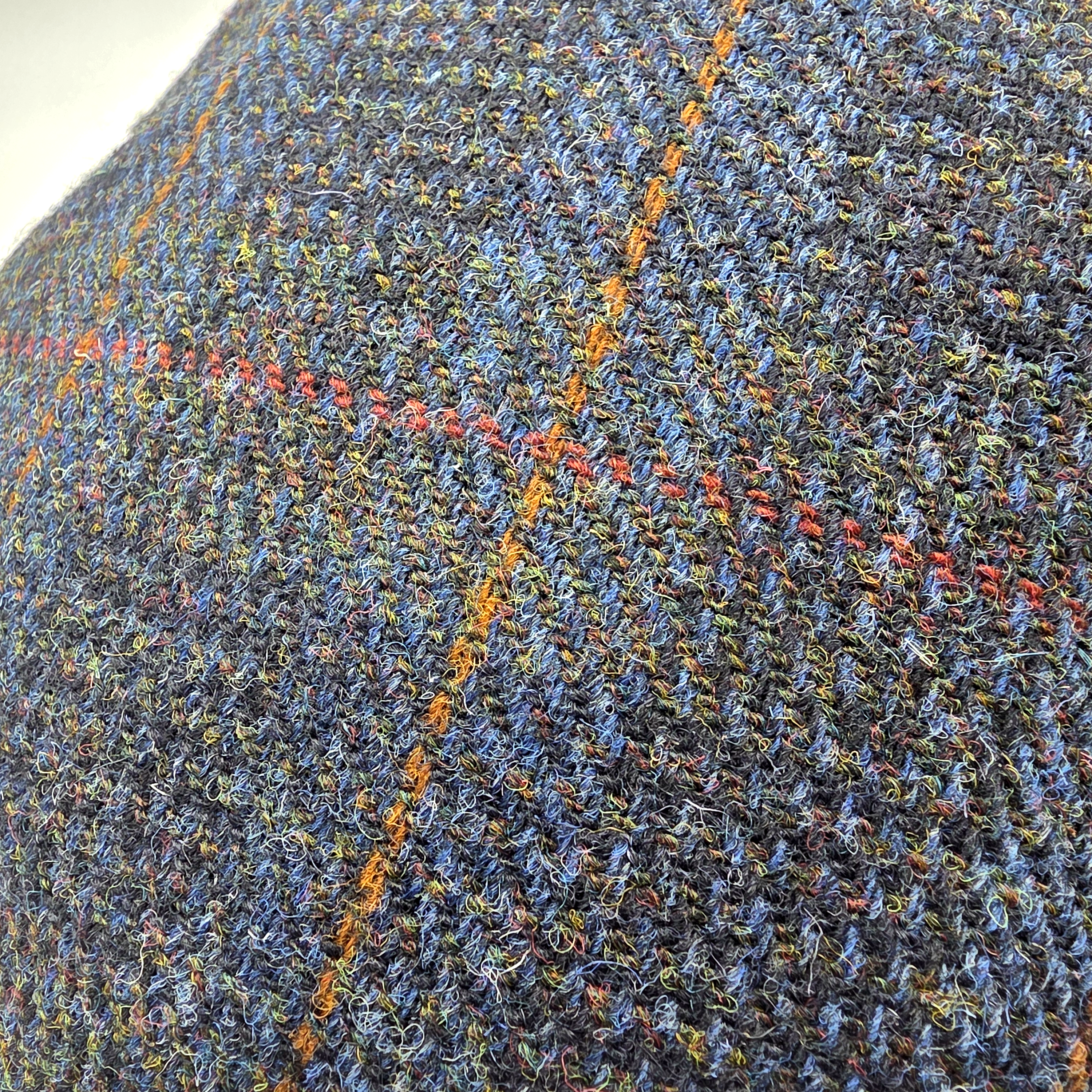 Close-up of the blue Harris Tweed with orange and red overcheck