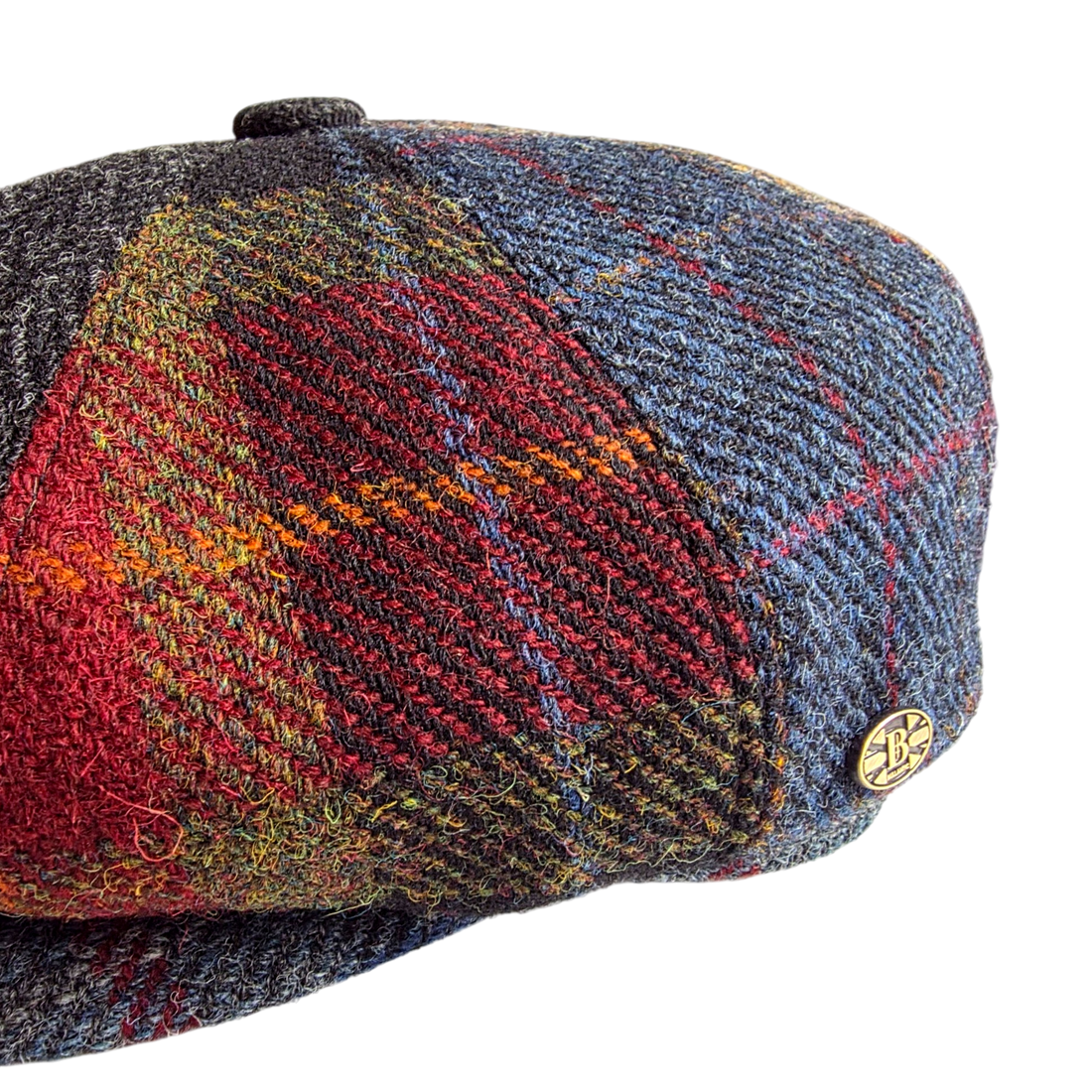 Close-up of the red tartan and blue tweed patchwork panels
